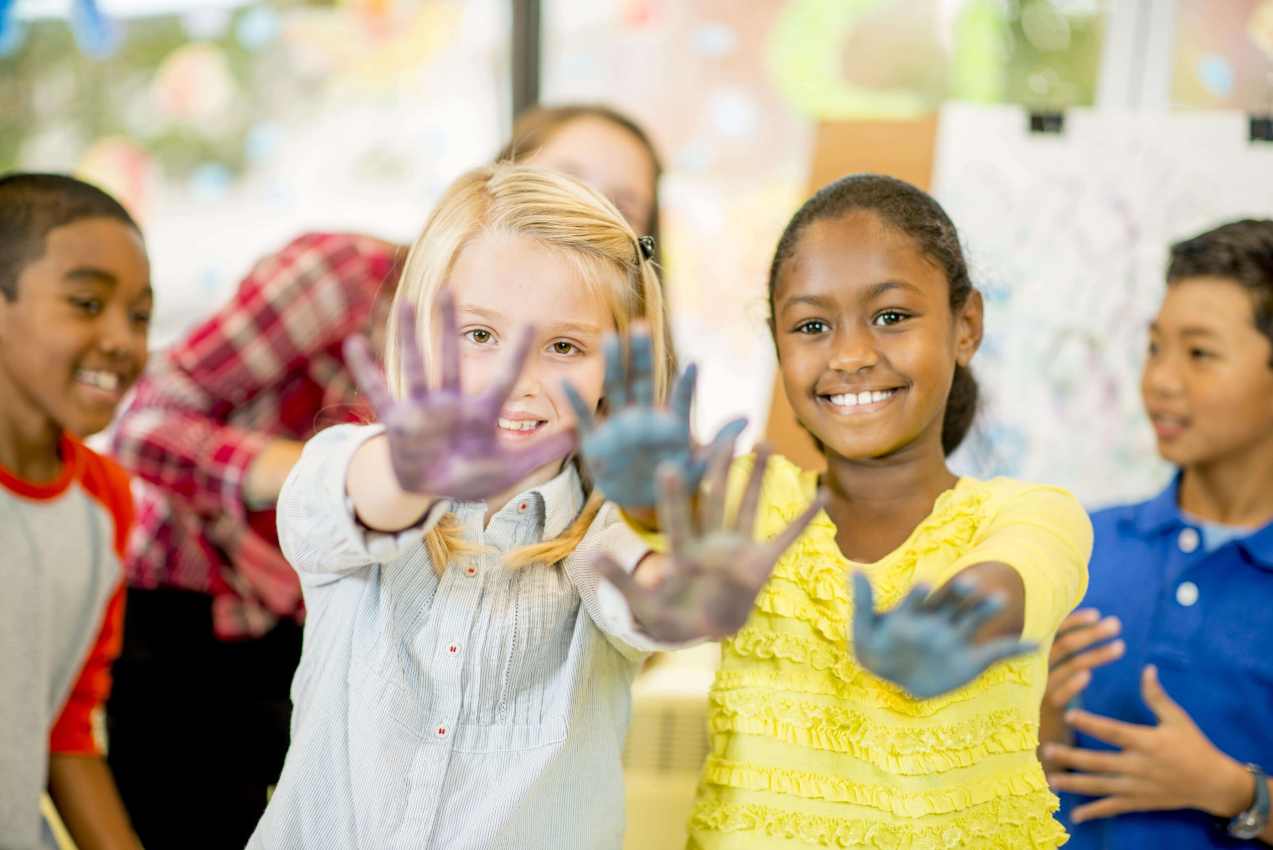 Kids with hands painted.